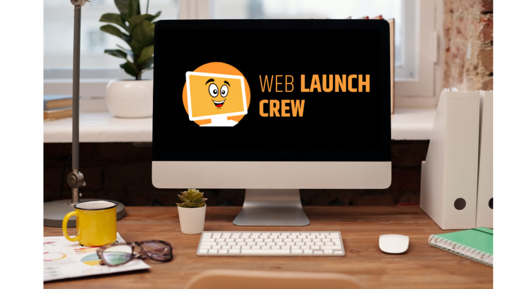 computer screen on desk with eb Launch Crew logo
